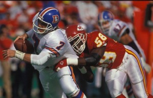 Chiefs LB Derrick Thomas (58) makes a play on Broncos QB John Elway (7). Credit: Photo used with permission by KCChiefs.com.