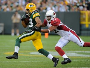 Aug 9, 2013; Green Bay, WI; Packers wide receiver Ty Walker (83) tries to get away from Cardinals safety Jonathon Amaya (27). Credit: Benny Sieu-USA TODAY Sports
