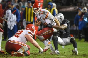 November 20, 2014; Oakland, CA; Raiders free safety Charles Woodson (24) sacks Chiefs quarterback Alex Smith (11) at O.co Coliseum. Credit: Kyle Terada-USA TODAY Sports