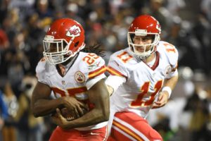 Nov. 20, 2014; Oakland, CA, USA; Chiefs quarterback Alex Smith (11) hands off to running back Jamaal Charles (25) against the Oakland Raiders at O.co Coliseum. Mandatory Credit: Kyle Terada-USA TODAY Sports