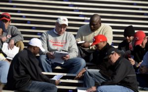 Jan 22, 2013; Mobile, AL; Chiefs general manager John Dorsey huddles with scouts and coaches following the Senior Bowl South Squad practice at Ladd-Peebles Stadium. Credit: John David Mercer-USA TODAY Sports