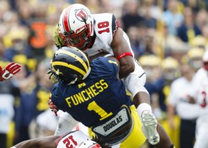 Sep 20, 2014; Ann Arbor, MI; Utah defensive back Eric Rowe (18) delivers a hit on Michigan wide receiver Devin Funchess (1) in the first quarter at Michigan Stadium. Credit: Rick Osentoski-USA TODAY Sports