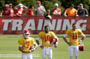 Chiefs quarterbacks Aaron Murray (7), Chase Daniel (10) and Alex Smith (11) watch a drill during 2014 training camp. (AP Photo/Charlie Riedel)