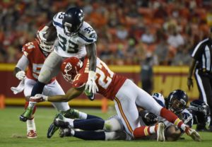 Aug. 21, 2015; Kansas City, MO; Chiefs strong safety Tyvon Branch tackles Seattle Seahawks running back Christine Michael (33) during the second half of preseason action at Arrowhead Stadium. (AP Photo/Ed Zurga)