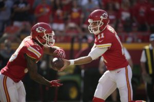 Oct. 11, 2015; Kansas City, MO; Chiefs quarterback Alex Smith (11) hands off the ball to running back Charcandrick West (35) against the Chicago Bears at Arrowhead Stadium. (AP Photo/Charlie Riedel)
