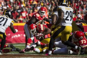 Oct. 25, 2015; Kansas City, MO: Chiefs running back Chacandrick West (35) leaps over the pile for a touchdown in the third quarter against the Pittsburgh Steelers at Arrowhead Stadium. (Emily DeShazer/The Topeka Capital-Journal)